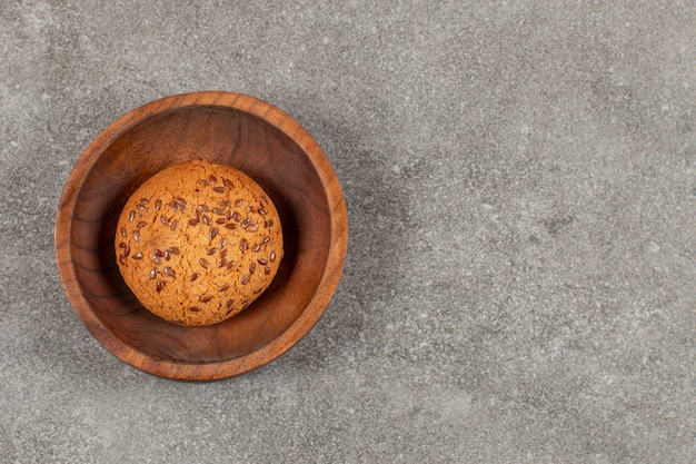 Top view of Freshly baked homemade cookie in wooden bowl.