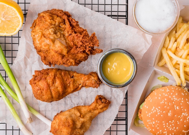 Free photo top view fried chicken with burger and fries