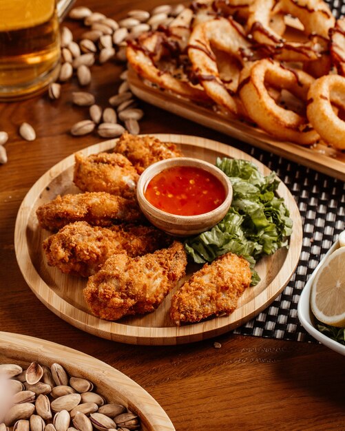 A top view fried chicken with sauce peanuts and lemon on the table food meal dinner