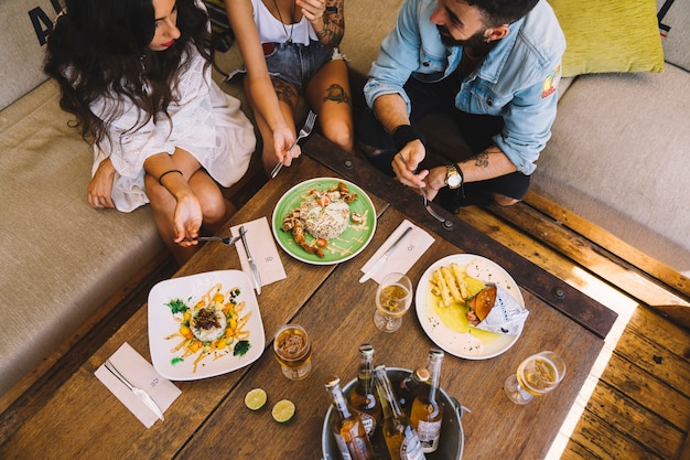 Free photo top view of friends eating