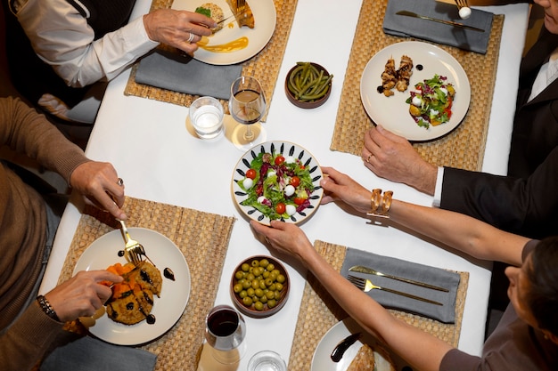 Free photo top view friends having lunch  in luxury restaurant