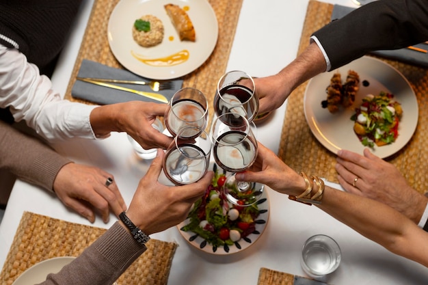 Free photo top view friends having lunch  in luxury restaurant