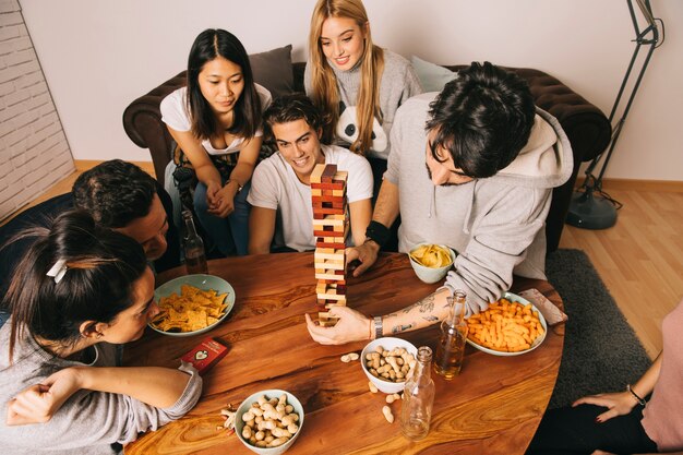 Top view of friends playing tabletop game