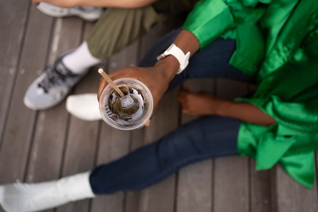 Top view friends with iced coffee