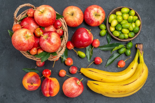 Free photo top view from afar fruits nectarines mandarins cherries apples citrus fruits bananas