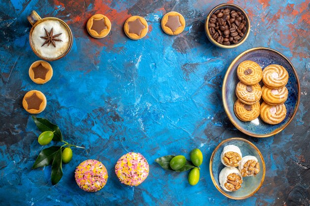 Top view from afar sweets cookies coffee beans citrus fruits Turkish delight