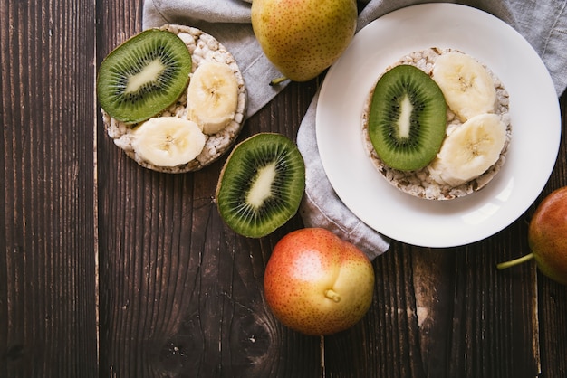 Top view fruit breakfast on wooden background