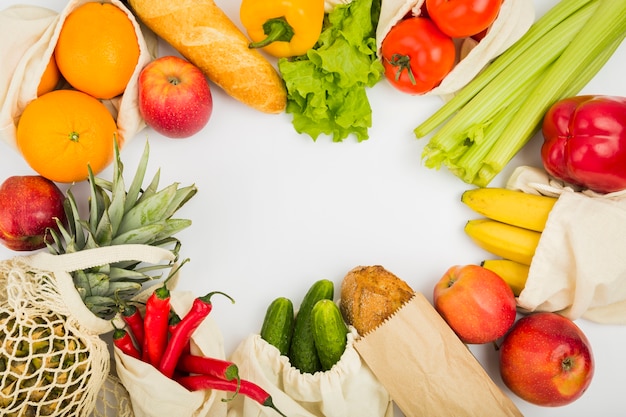 Top view of fruit and vegetables in reusable bags