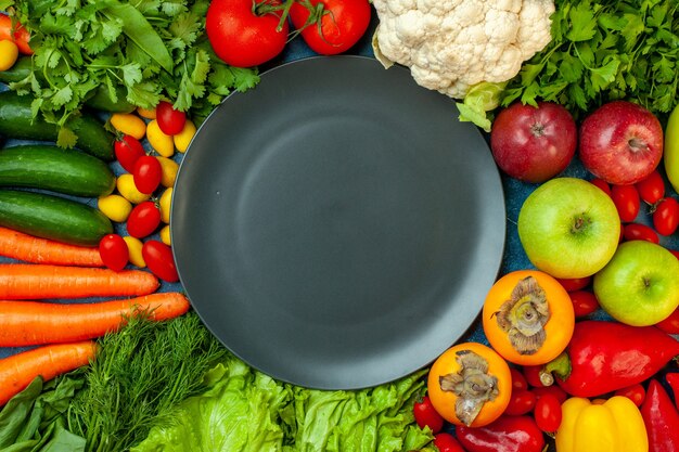 Top view fruits and vegetables on blue background