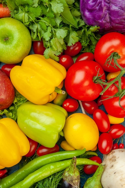 Top view fruits and vegetables cherry tomatoes lemon tomatoes apple red cabbage coriander