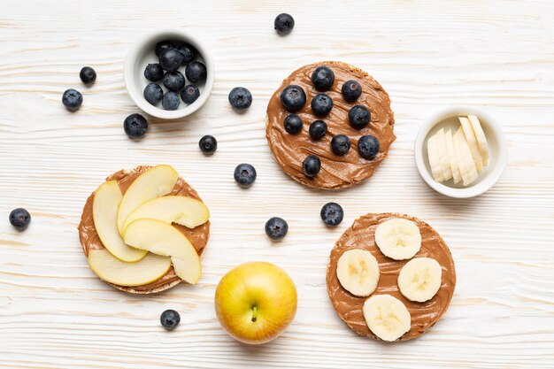 Top view fruits on wooden background