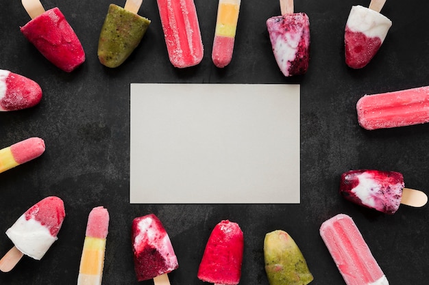 Free photo top view of fruity popsicles with copy space