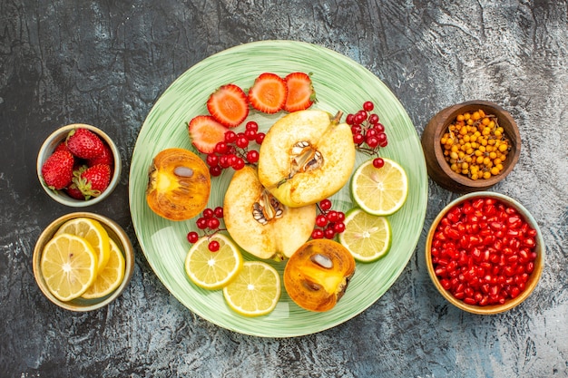 Free photo top view of fruity salad with fresh sliced fruits