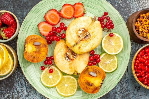 Free photo top view of fruity salad with fresh sliced fruits