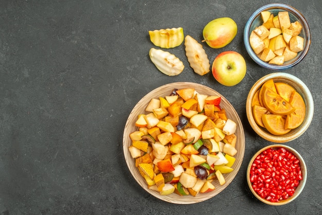 Top view of fruity salad with fresh sliced fruits