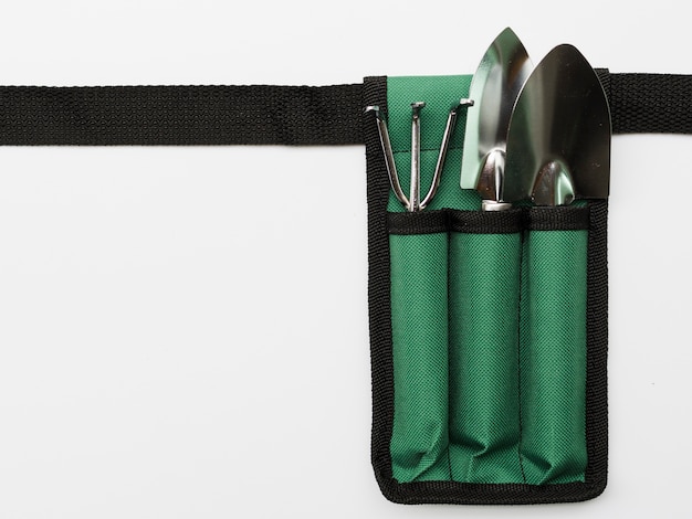 Top view gardening tools on bag