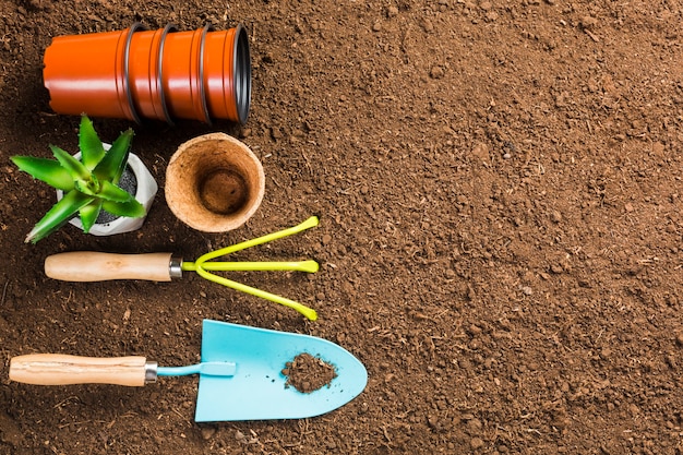 Top view of gardening tools on the ground