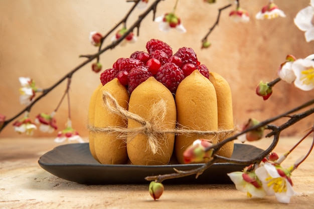 Free Photo top view of a gift cake with fruits on the right side of mixed color background