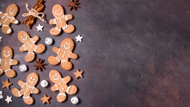 Free Photo top view of gingerbread cookies with cinnamon sticks for christmas and copy space