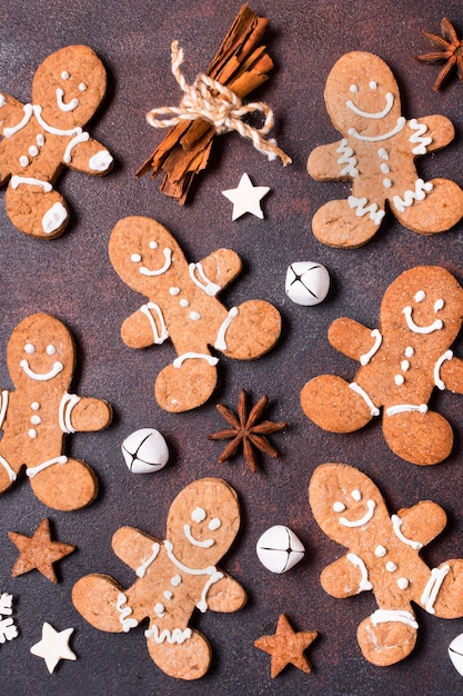 Top view of gingerbread cookies with cinnamon sticks for christmas