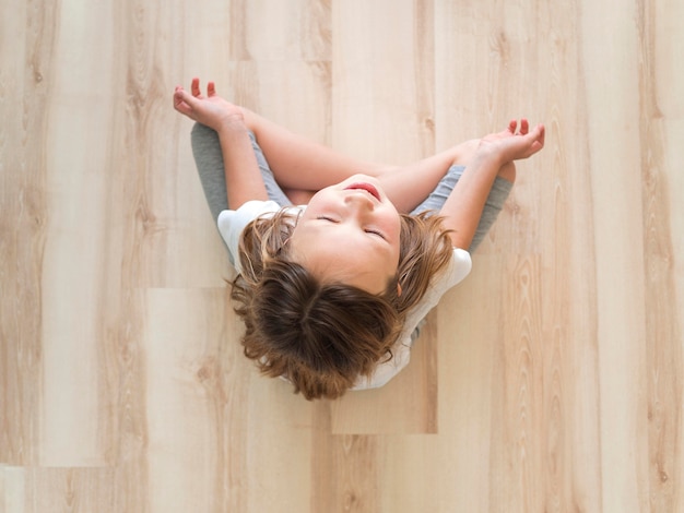 Top view girl meditating