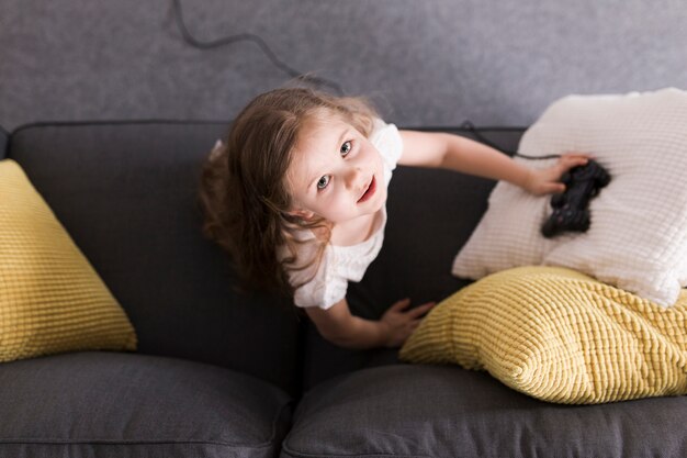 Top view of girl with gamepad