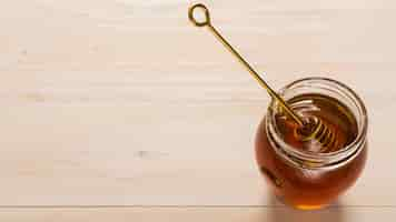 Free photo top view glass jar full of honey