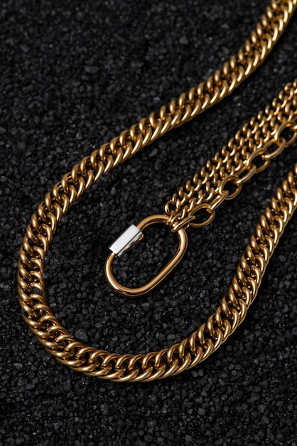 Top view gold chains on dark background