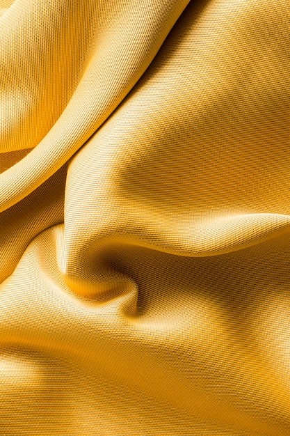 Free Photo top view golden fabric texture concept