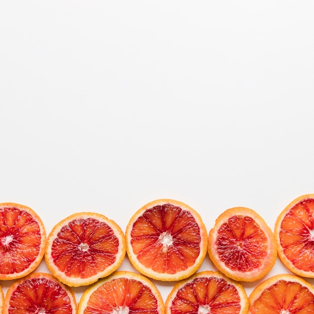 Free Photo top view grapefruit slices with copy space