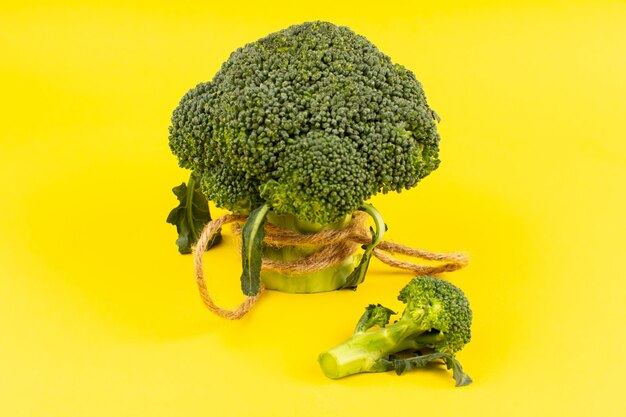 top view green broccoli fresh ripe on the yellow background