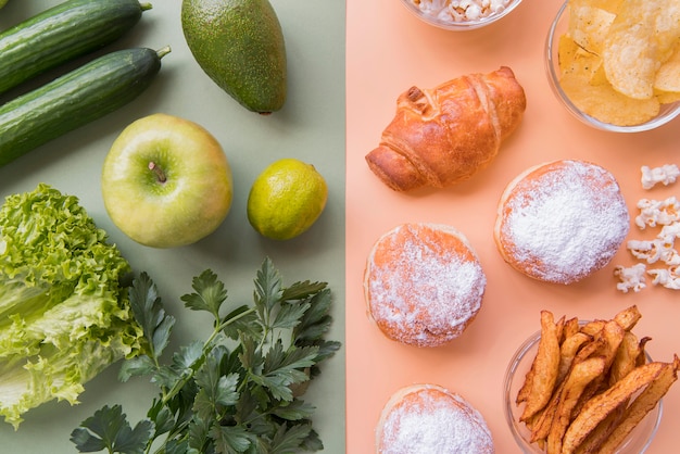 Free Photo top view green fruits and vegetables with unhealthy snack