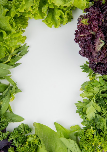 Free Photo top view of green vegetables on white surface with copy space