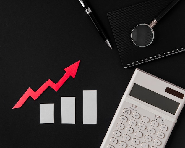 Free photo top view of growth arrow with calculator