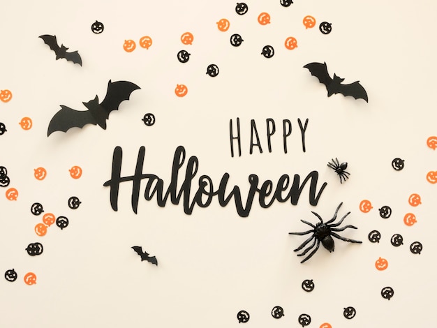 Free Photo top view halloween concept with greeting