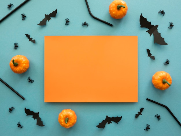 Free photo top view halloween concept with pumpkins