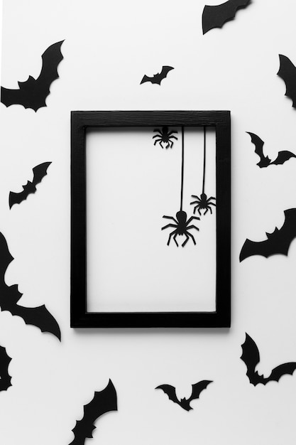 Free photo top view halloween frame with spiders