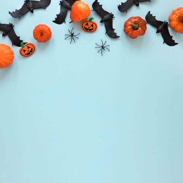 Free Photo top view halloween pumpkins and bats with copy space