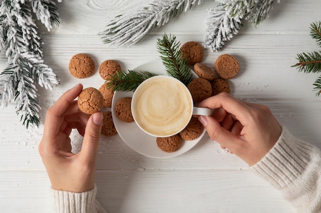 Top view hands holding coffee cup