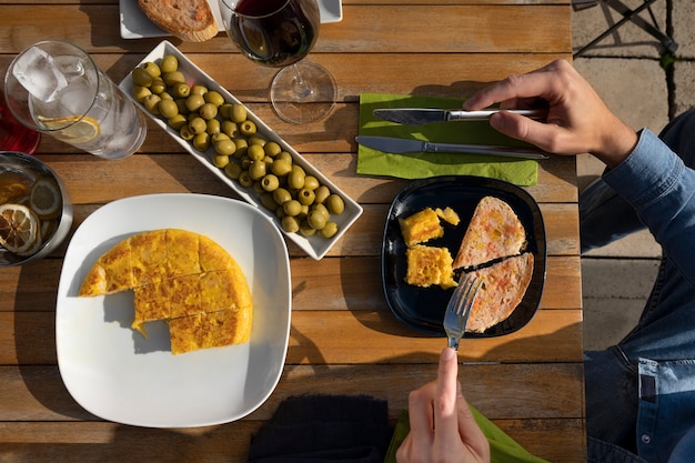 Free Photo top view hands holding cutlery