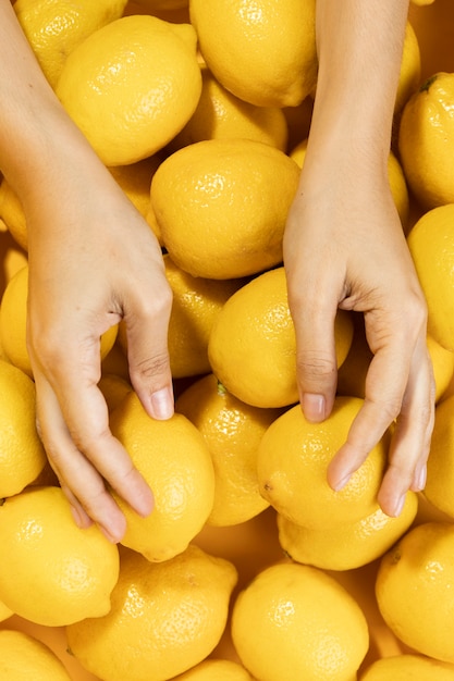 Top view hands touching lemons