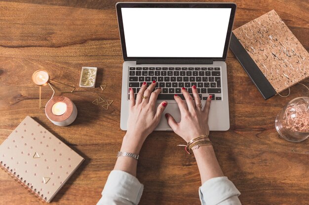 Top view of hands working with laptop