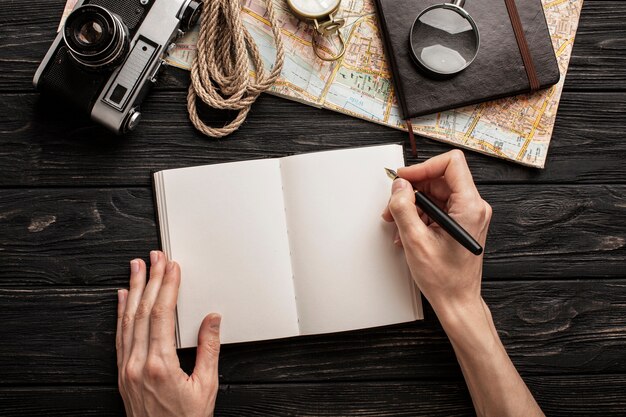 Top view hands writing on notebook