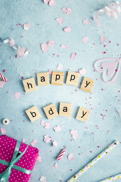 Free photo top view of happy birthday wish in wooden letters