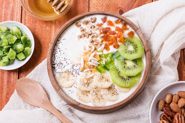 Top view healthy breakfast bowl with fruits and oats