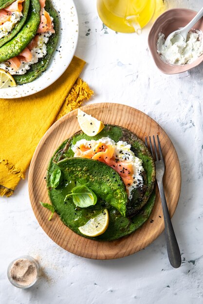 Free Photo top view of healthy breakfast with avocado, egg, lime, and mint leaf