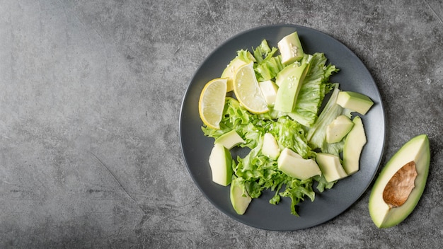 Free photo top view healthy salad with avocado