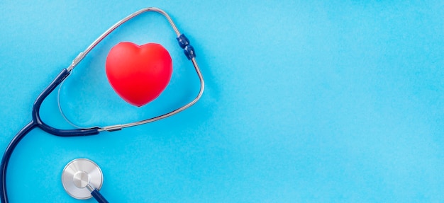 Top view of heart shape with stethoscope and copy space