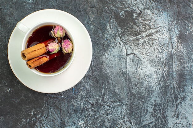 Top view of herbal tea on grey background