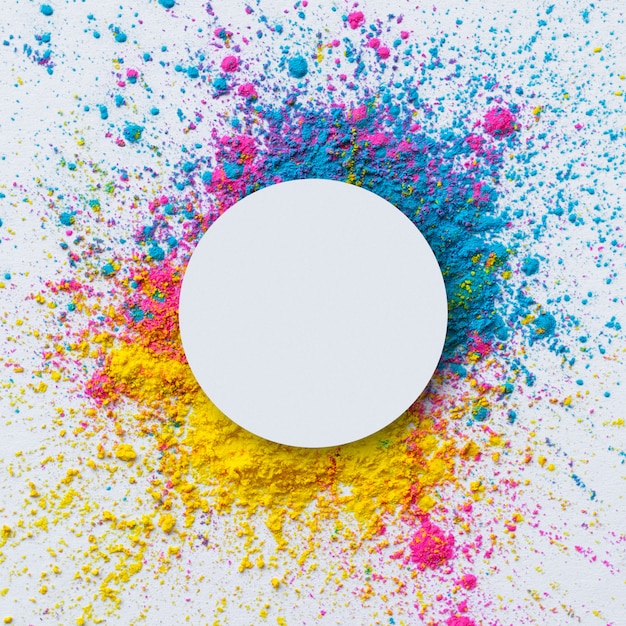 Top view of holi color on a white background with blank circle